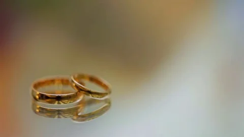 Wedding rings lie on the surface Stock Footage 73351197