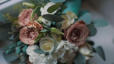 Wedding rings lie in Wedding bouquet Stock Footage