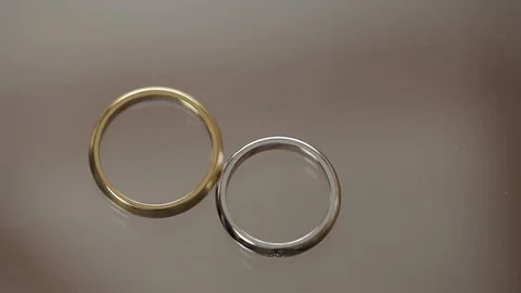 Wedding Rings macro closeup gold and silver diamon Jewellery Stock Footage 93713772