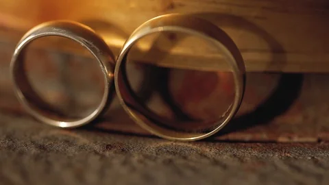 Wedding Rings macro closeup gold and silver diamon Jewellery in sunlights Stock Footage 114489899