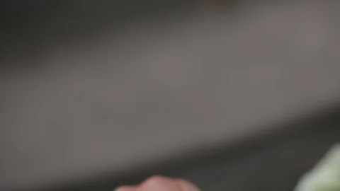 Wedding Rings macro closeup squeezes the rings with his hand gold diamon Stock Footage 93713245