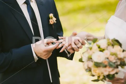 Wedding Rings. Matrimony. Man And Woman Exchanging Wedding Rings