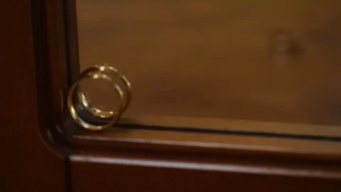 Wedding rings on the miror Stock Footage 82942578