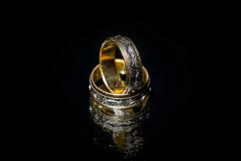 Wedding rings on mirror Stock Photos