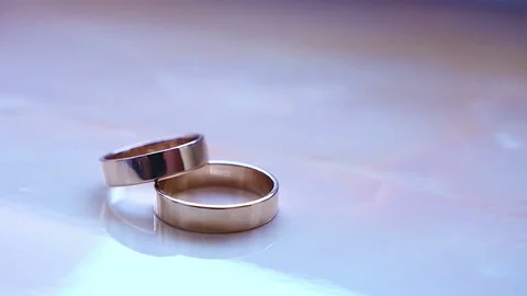 Wedding rings out of focus Stock Footage 76136017