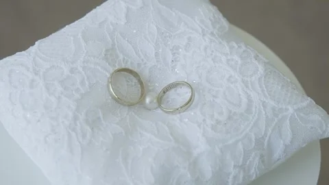 Wedding rings on a pillow close-up Video stock 306147677