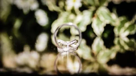 Wedding Rings Placed with Flowers Stock Photos