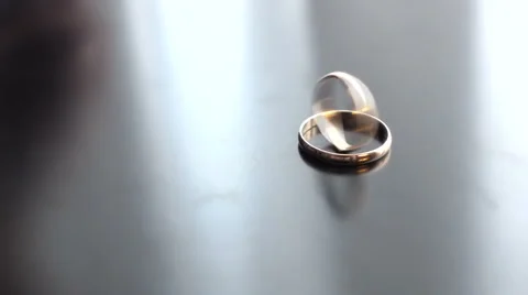 Wedding rings rotating in each other Stock Footage 55684226