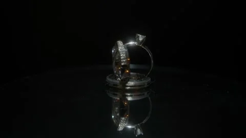 Wedding rings rotating on a platform 360º Stock Footage 267599243