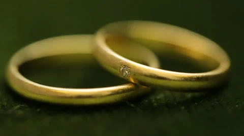 Wedding rings rotating with textured background Stock Footage 68628407