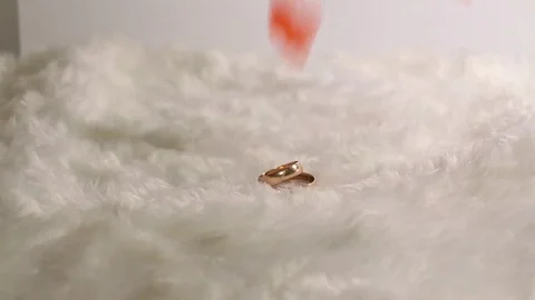 Wedding rings rotating with textured background Stock Footage 71101044