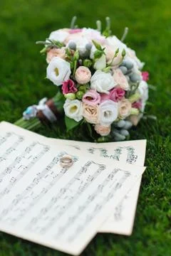 Wedding rings on a sheet of paper with notes Stock Photos