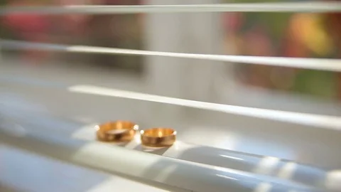Wedding rings shine in the light Stock Footage 80673855
