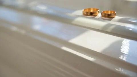 Wedding rings shine in the light Stock Footage 80674259