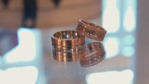 Wedding rings on a shiny surface Stock Footage 75167662