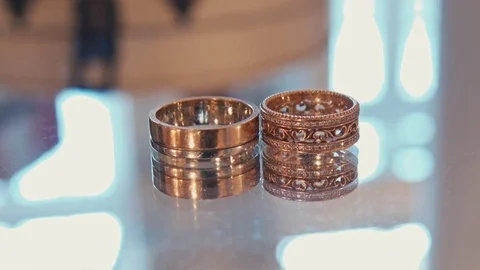 Wedding rings on a shiny surface Stock-Footage 75167705