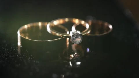 Wedding rings sprinkled with perfume. Macro. Stock Footage 131338846