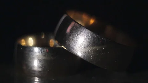 Wedding Rings Stacked on a Dark Background Stock Footage 83008279