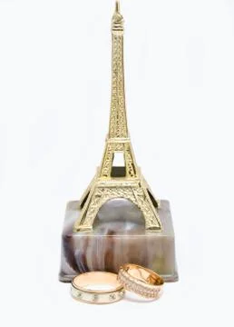 Wedding rings on the statue Eiffel Tower Stock Photos
