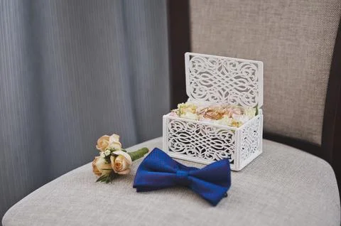Wedding rings in a stylish box on a substrate of rose buds 2312. Stock Photos