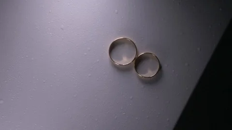 Wedding rings on the table Stock Footage 93177593