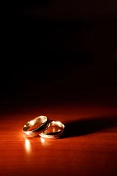 Wedding rings on the table Stock Photos