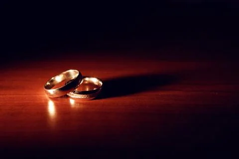 Wedding rings on the table Stock Photos
