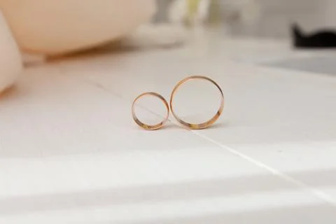 Wedding rings on the table Stock Photos
