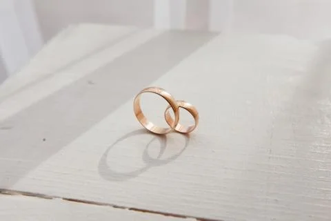 Wedding rings on the table Stock Photos