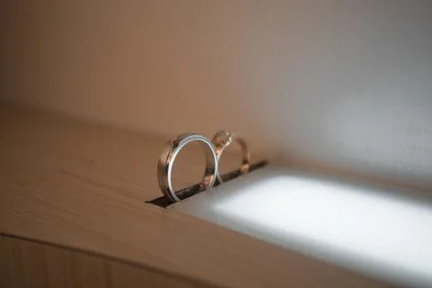 Wedding rings on the table Stock Photos