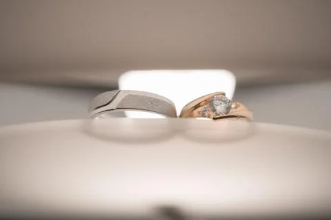 Wedding rings on the table Stock Photos