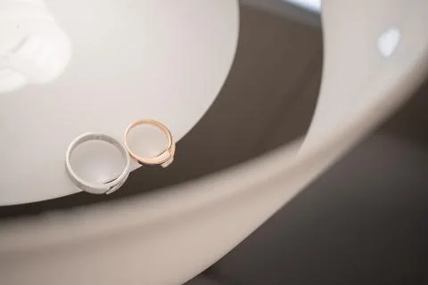 Wedding rings on the table Stock Photos
