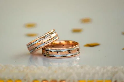 Wedding rings on the table Stock Photos
