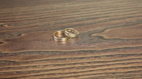 Wedding rings on the table rotation Stock Footage 61437394