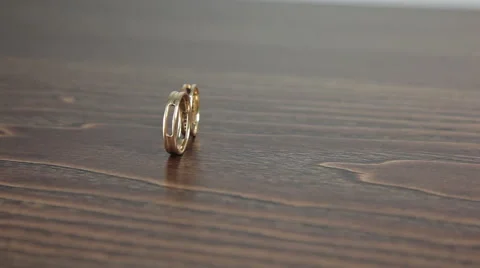 Wedding rings on the table rotation Stock Footage 61437623