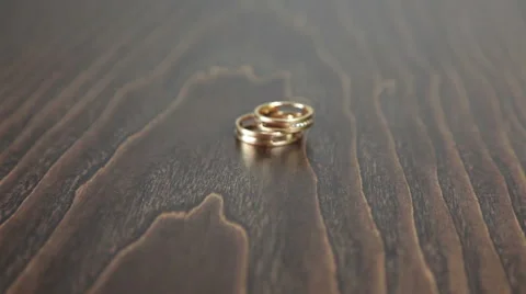 Wedding rings on the table rotation Video stock 61437788