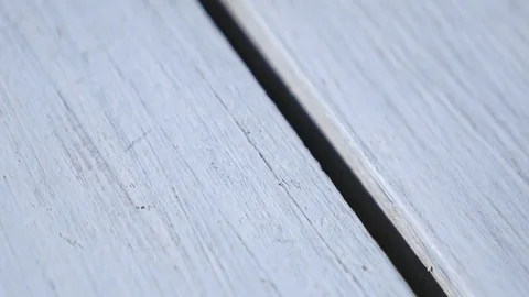 Wedding rings on wooden surface, symbol of wedding and couple Stock Footage