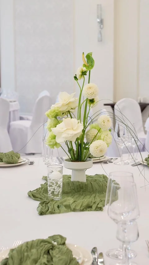 Wedding romantic composition for wedding table decoration in white and green col Stock Footage 318932443