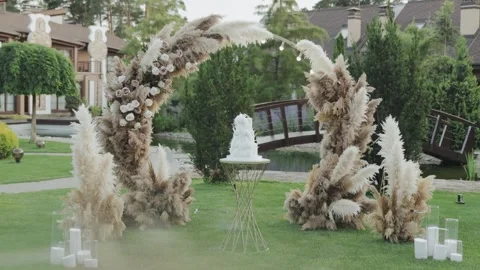 A wedding scene with an elegant cake and a pampas grass arch Stock-Footage 306292249