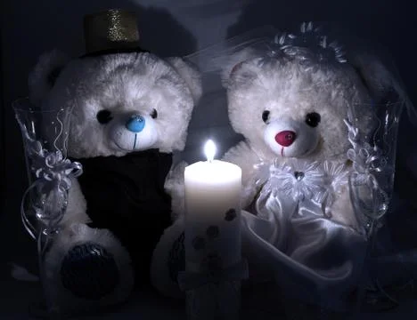Wedding setting: hand made teddy boy and girl, white and gold candle, wedding Stock Photos