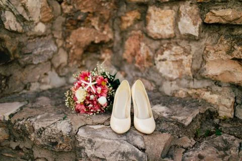 Wedding shoes on the pool background Stock Photos