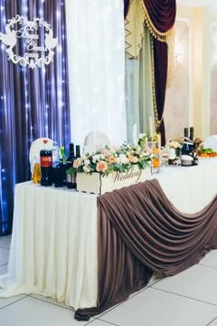 Wedding table for the bride and groom decorated with cloth and flowers 写真素材