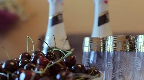 The wedding table. Champagne, cherries and white flowers. Vídeos de archivo 68657131