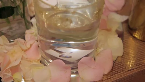 Wedding table decor. candle in a vase with water. Stock Footage 75538527