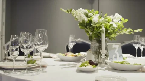 Wedding table decor with fresh flowers, wedding banquet, slow motion camera Video stock 306148109