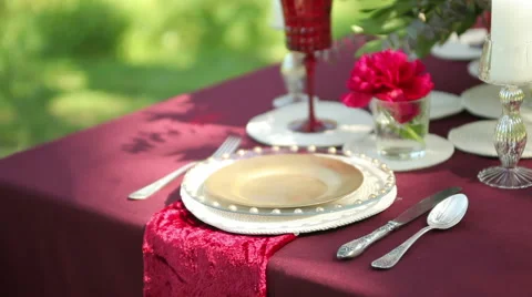 Wedding table decor in nature with candles, close-up. Steadicam shot Stock Footage 50976238