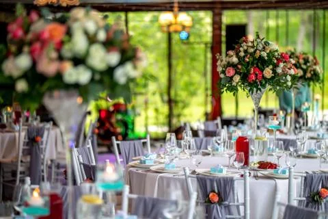 Wedding table decorated with flowers and dishes Stock Photos