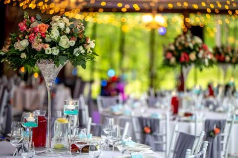 Wedding table decorated with flowers and dishes Stock Photos