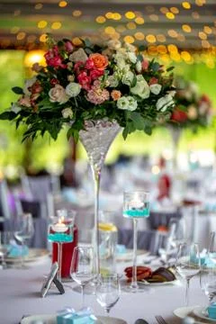 Wedding table decorated with flowers and dishes Stock Photos