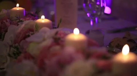 Wedding table decorated with flowers, decorative glass candles Vídeos de archivo 63543896